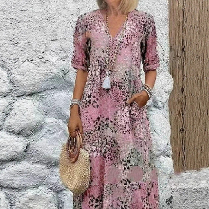 Maxi dress for women with V-neckline and practical side pockets Lune London