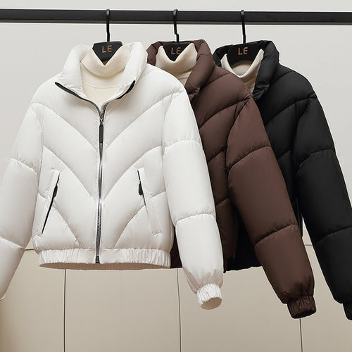 Trendy and comfortable women's puffer jacket with high collar and practical piped pockets Lune London