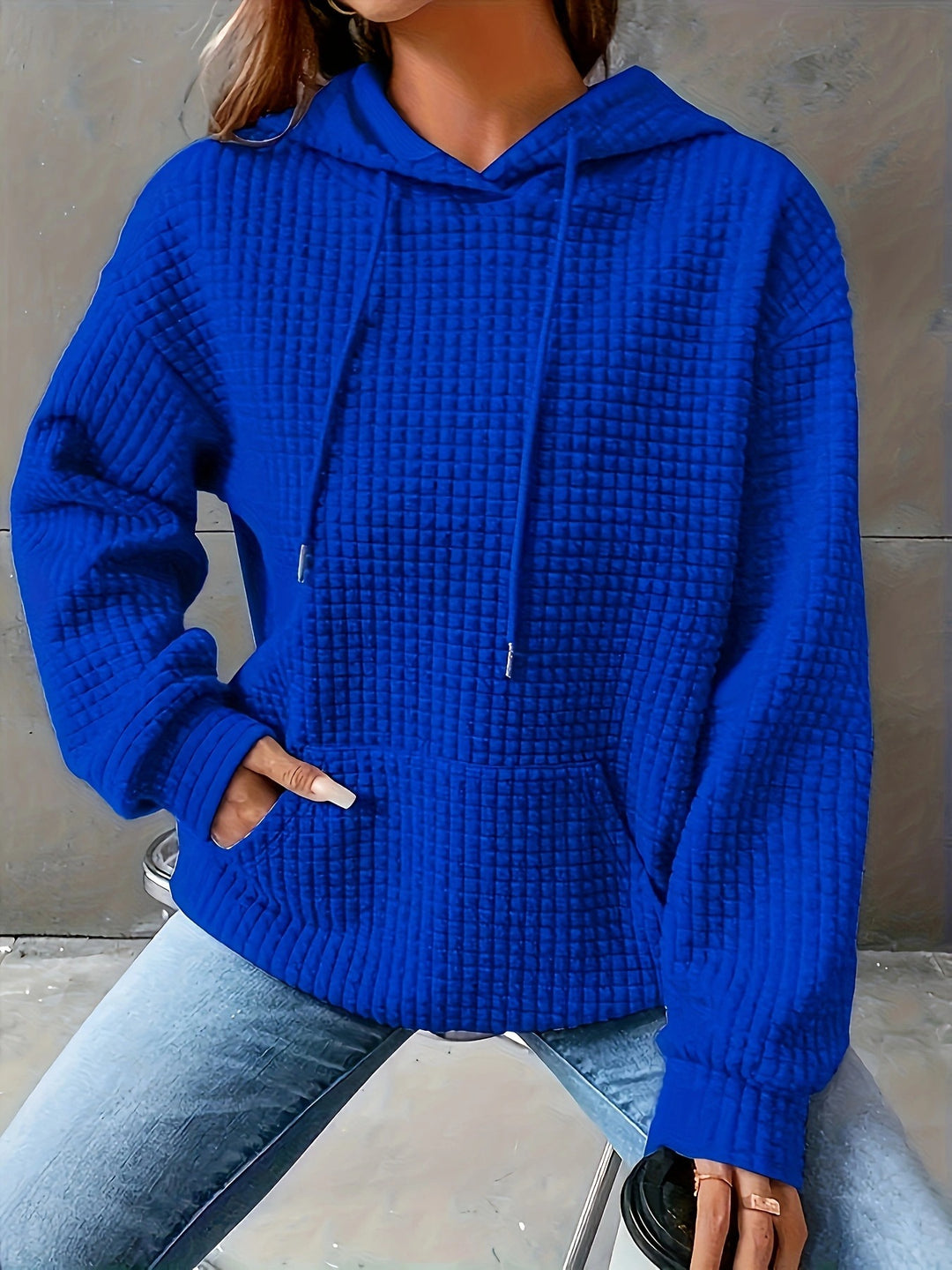 Sweat à capuche femme en motif waffle texturé avec poches latérales Chic & Stil