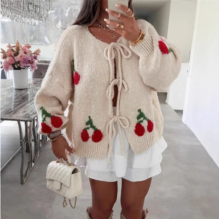 Women's knitted jacket with playful cherry pattern and decorative bows Lune London