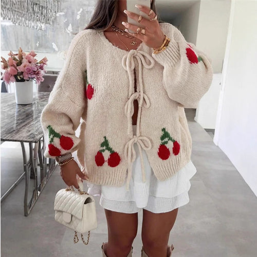 Women's knitted jacket with playful cherry pattern and decorative bows Lune London