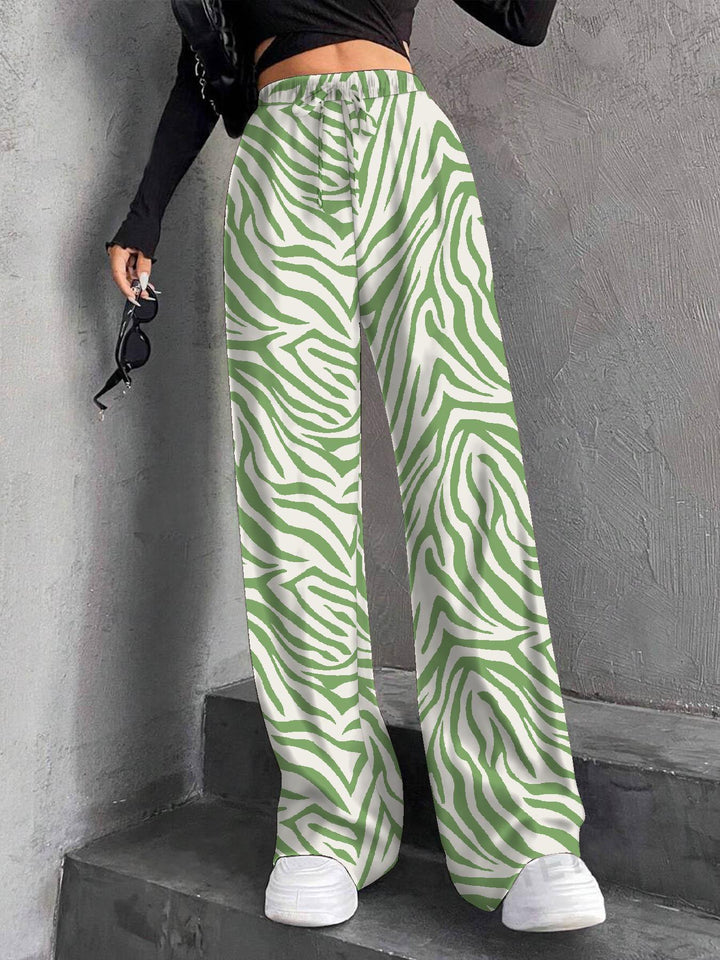 Pantalons plissés à coupe large pour femmes avec taille élastique et poches latérales pratiques Chic & Stil