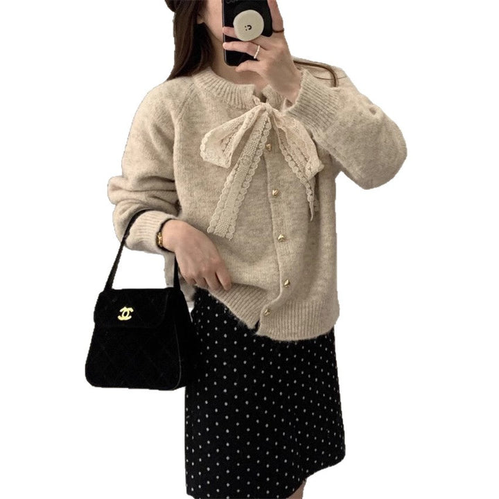 Women's knit jacket with playful lace ribbon and golden heart-shaped buttons Lune London