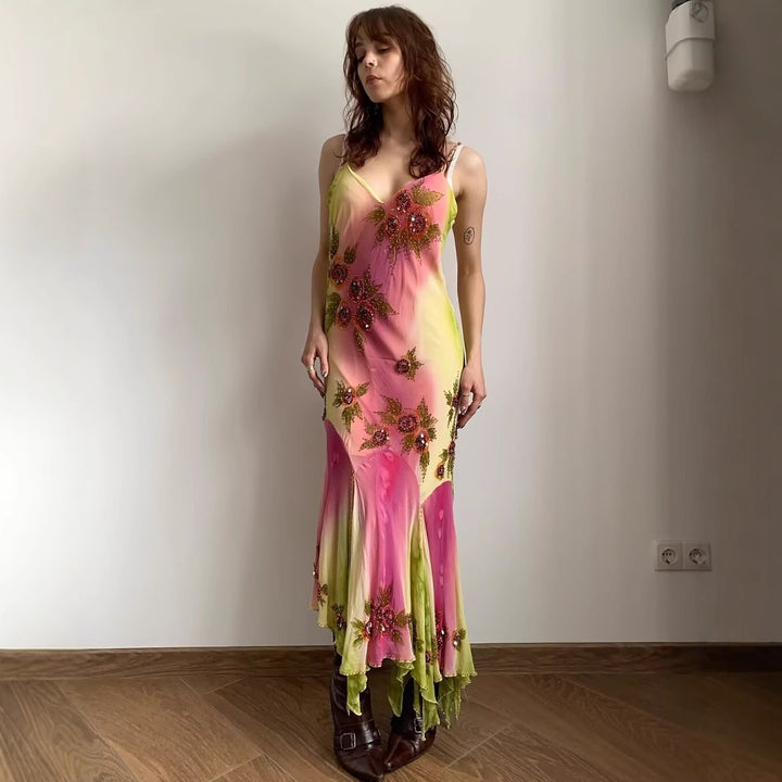 Asymmetrical summer dress for women with a floral design and delicate spaghetti straps Lune London