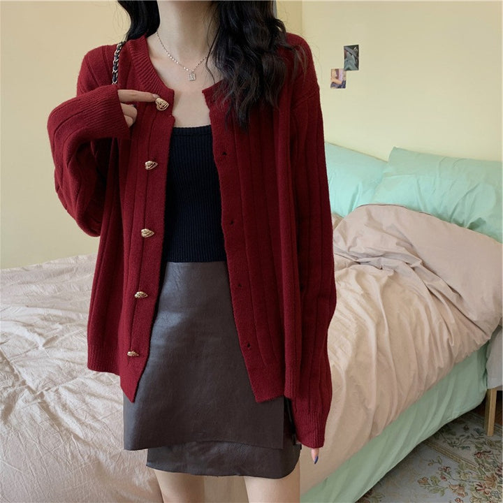Women's knit jacket with a decorative button design and a vertical ribbed pattern Lune London
