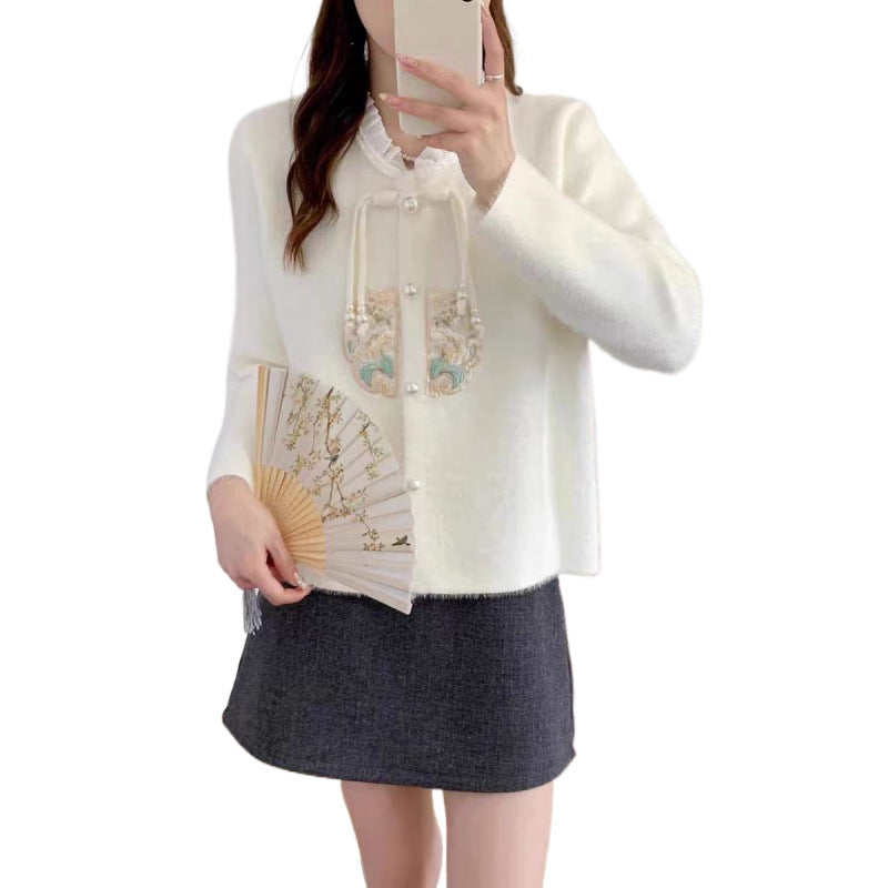 Luxurious knit sweater for women with decorative button details and ruffles Lune London