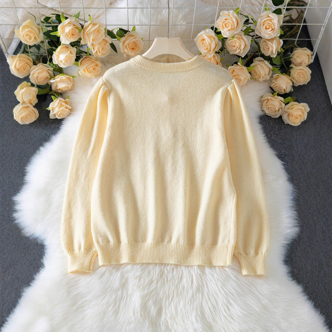 Elegant knitted jacket for women with fine diamond patterns and mother-of-pearl buttons Lune London