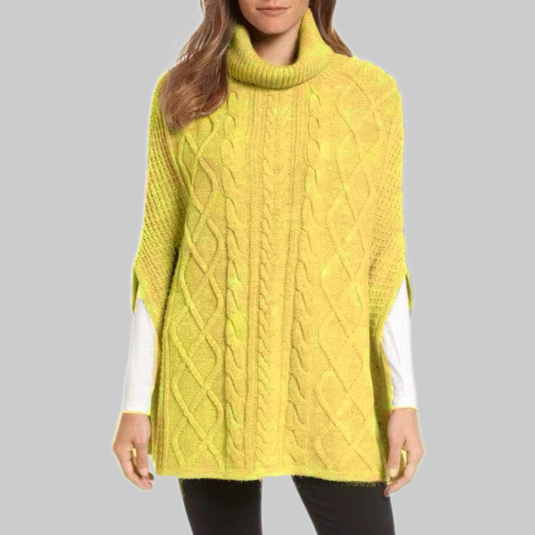 Knitted poncho for women with high collar and classic cable knit pattern Lune London