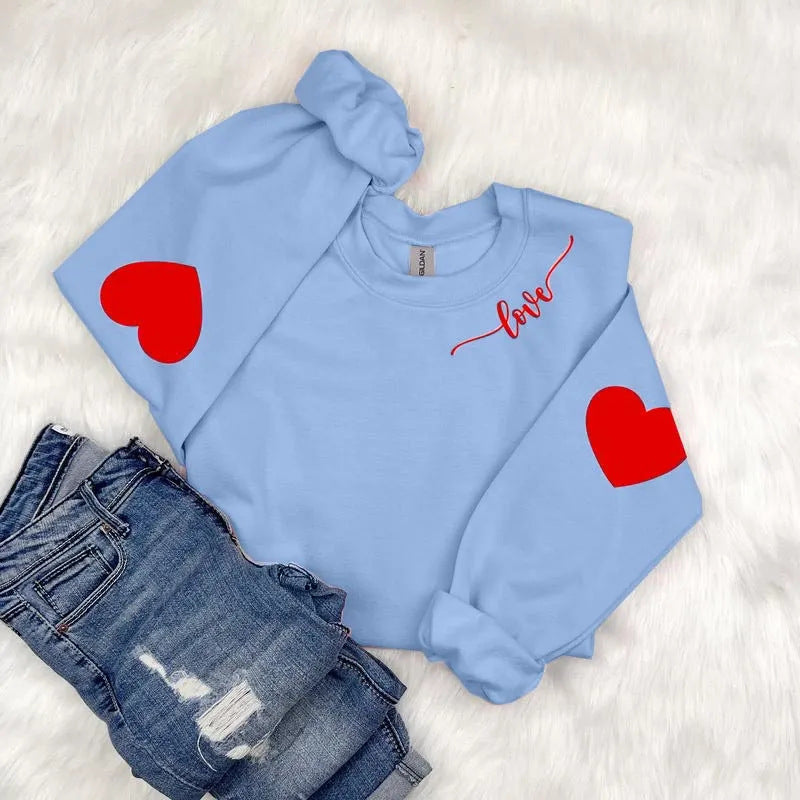 Sweatshirt femme avec design cœur et coupe décontractée Chic & Stil