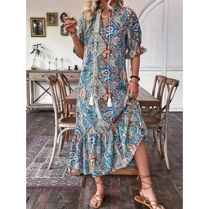 Maxi dress for women with playful paisley pattern and ruffled details Lune London