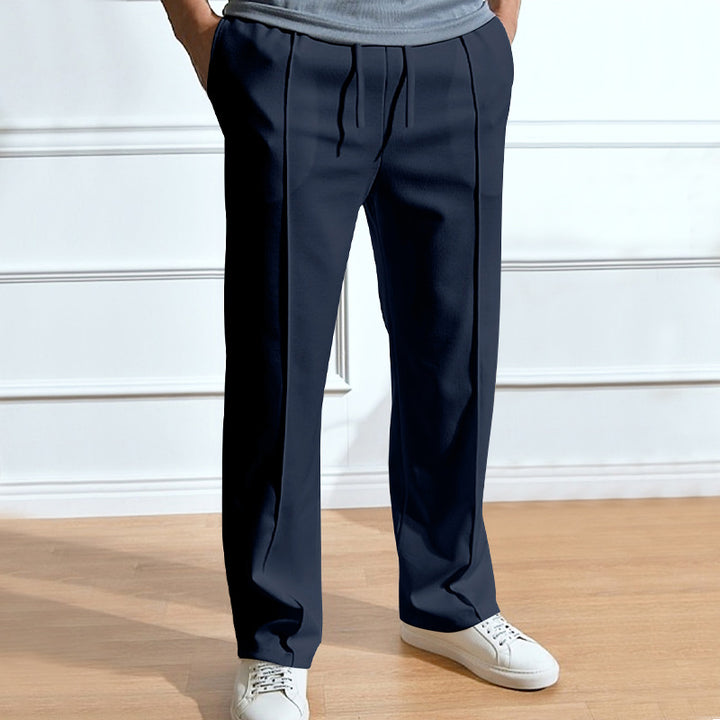 Men's leisure pants with elastic waistband and side snap buttons Lune London