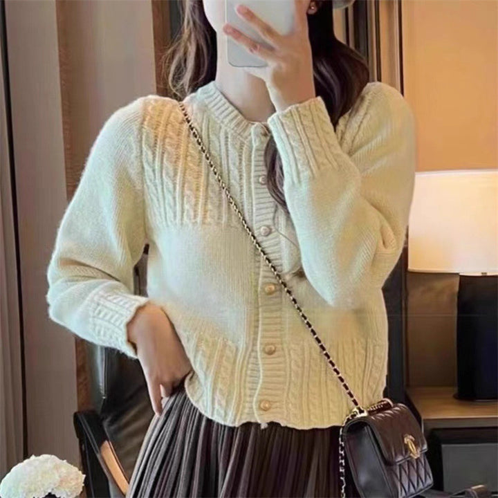 Ladies cozy knit pullover with cable texture and chic gold button details