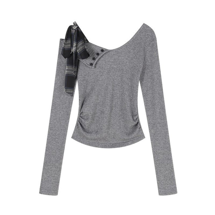 Women’s long sleeve top with modern asymmetric neckline and decorative button details Chic & Stil
