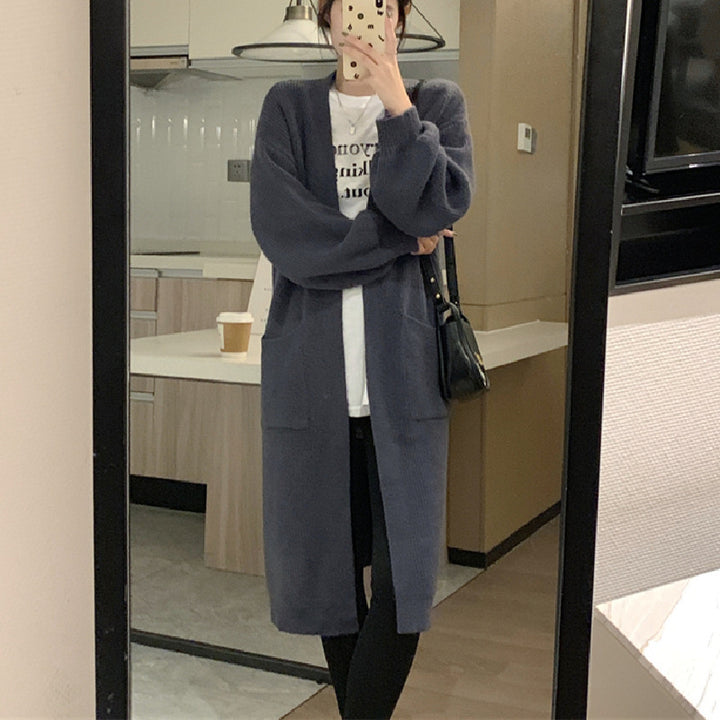 Ladies Long Knit Cardigan with practical pockets and chic elegant silhouette
