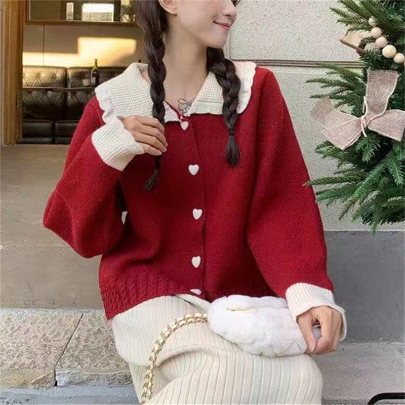 Knitted women's jacket with heart-shaped buttons and a distinctive ruffle collar Lune London
