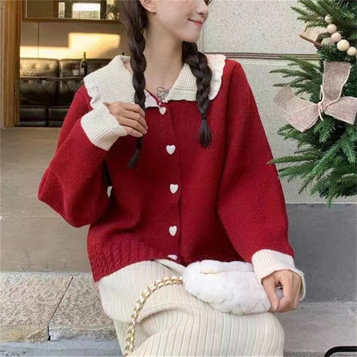 Knitted women's jacket with heart-shaped buttons and a distinctive ruffle collar Lune London