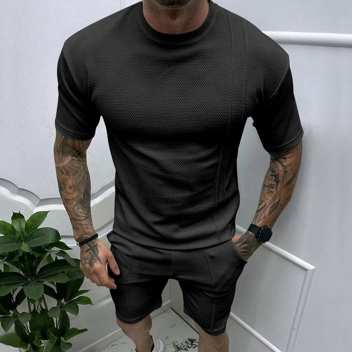 Men's short sleeve sports set with an innovative textured design and practical side pockets Lune London
