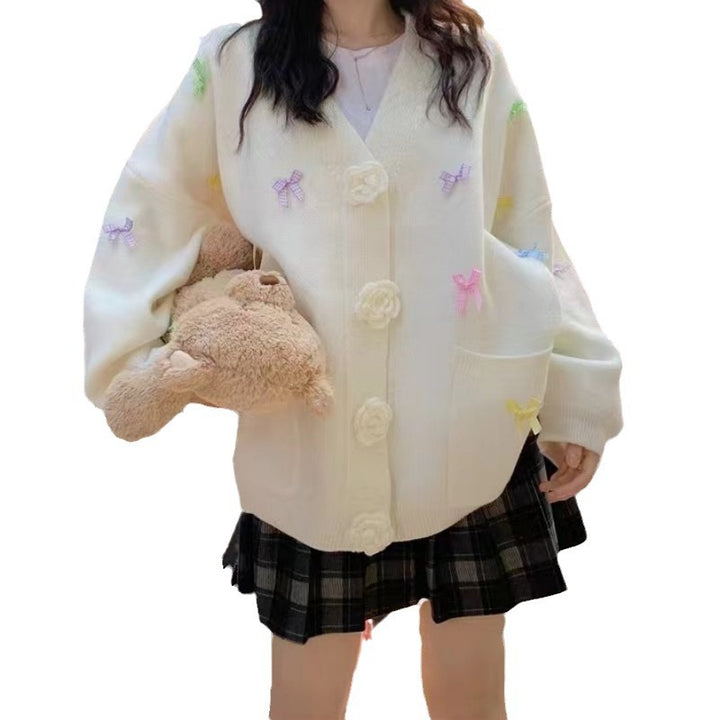 Ladies cardigan with playful flower appliqués and large buttons Lune London