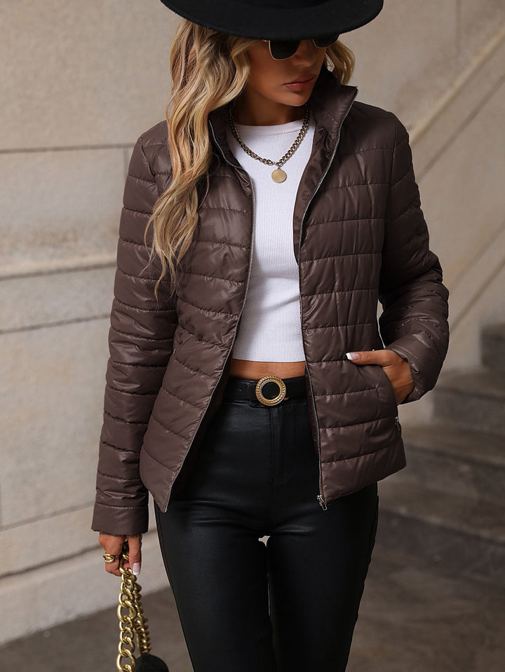 Quilted transitional jacket for women with high collar and practical pockets Lune London
