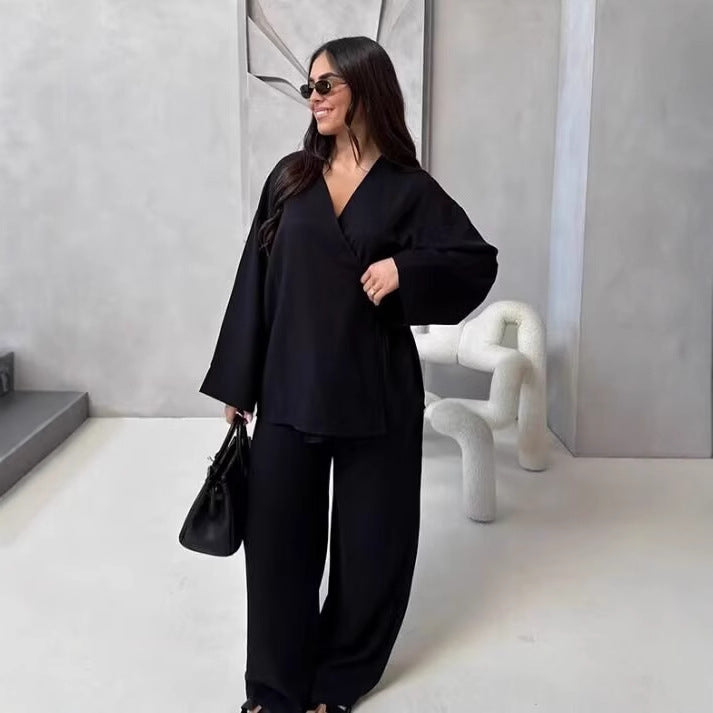 Ladies outfit consisting of an elegant V-neck blouse and wide palazzo pants Lune London