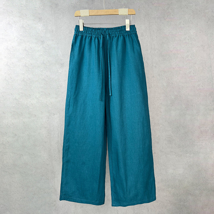 Casual linen pants for women with elastic waist and side pockets with openings.