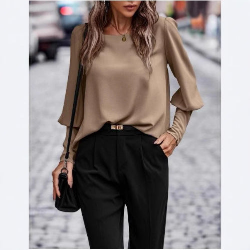 Elegant women's blouse with puff sleeve details and structured fabric Lune London