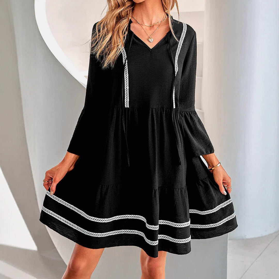 Casual mini dress for women with V-neck, decorative sleeve cuffs and playful hem Lune London