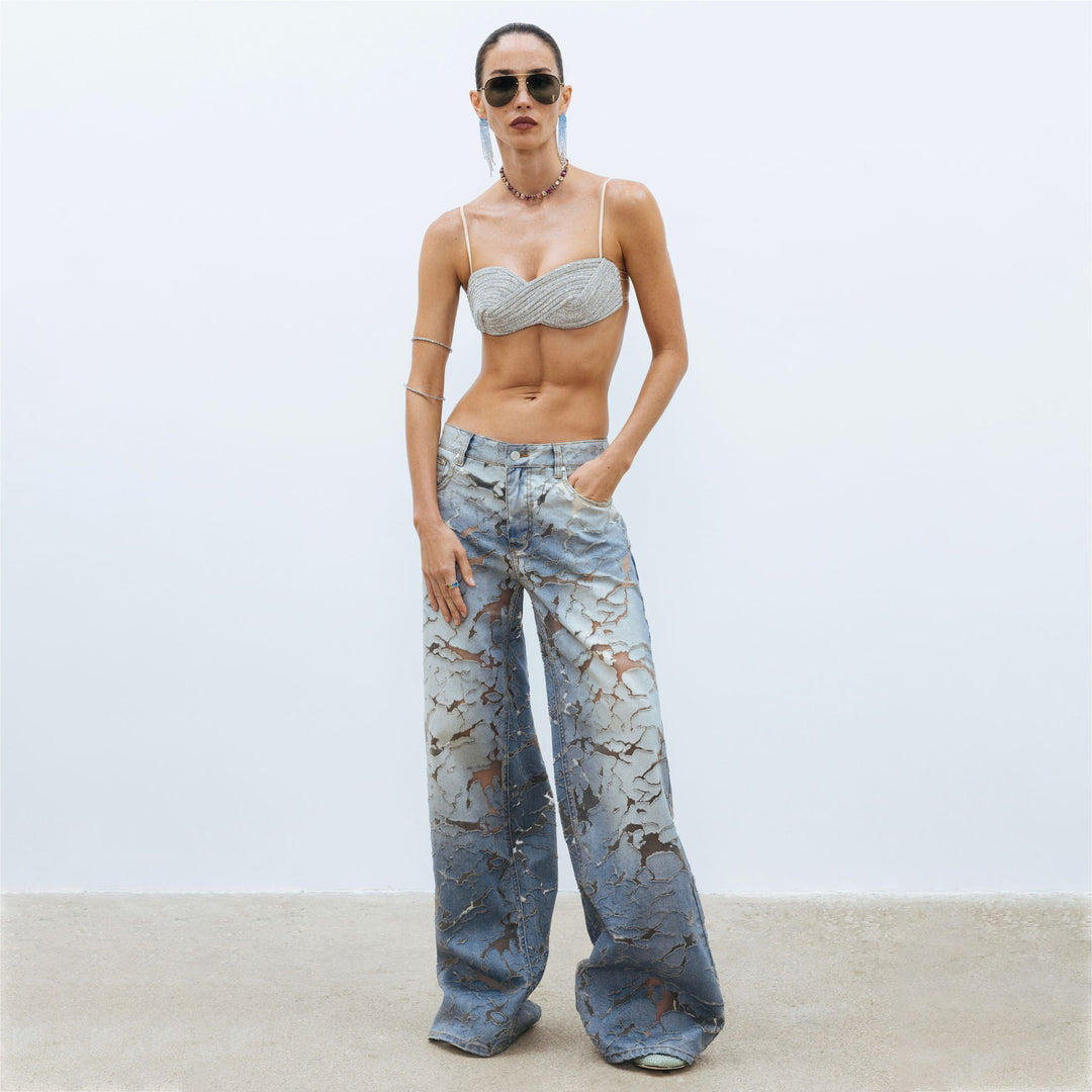 Ladies Flared denim pants with unique distressed details Lune London