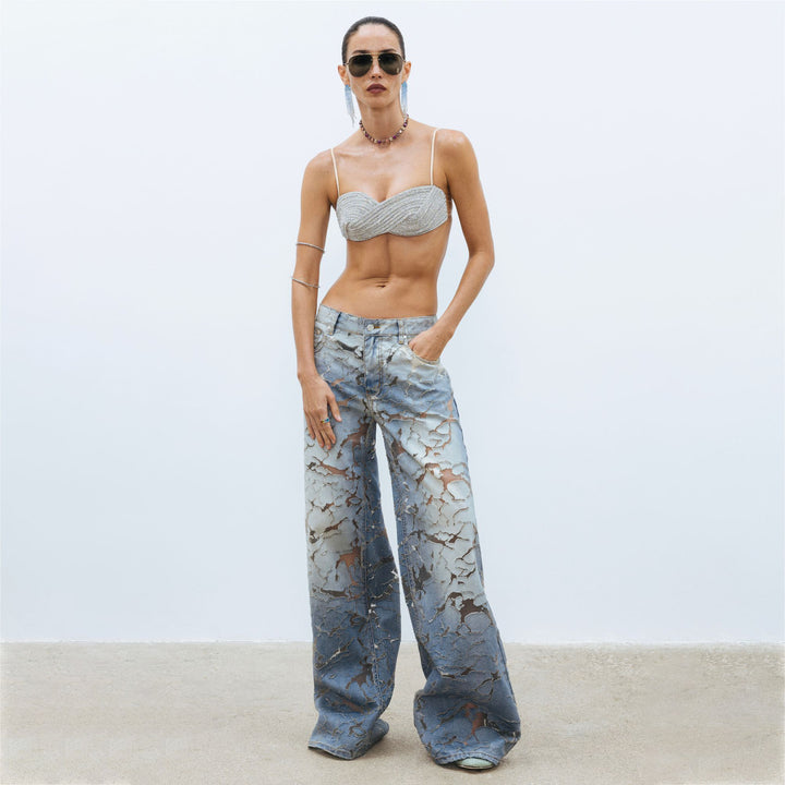 Ladies Flared denim pants with unique distressed details Lune London