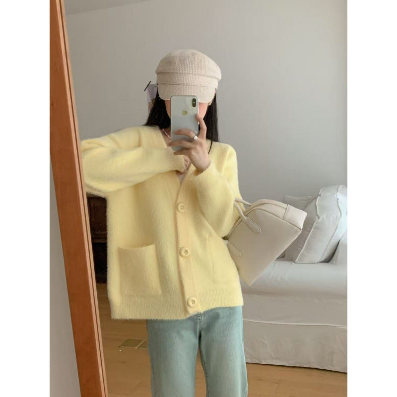 Cardigan pelucheux à boutons pour femmes avec poches élégantes Chic & Stil