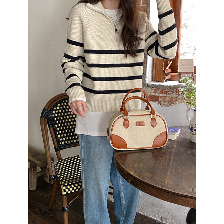 Pull féminin à la mode avec une fermeture éclair solide et un motif rayé Chic & Stil