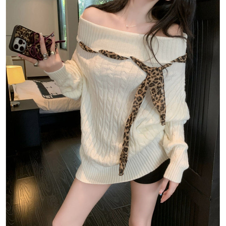 Chunky knit sweater for women with off-the-shoulder design and playful bow accent Lune London