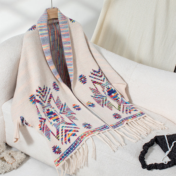 Wool poncho for women with colorful Navajo pattern and fringed hem Lune London