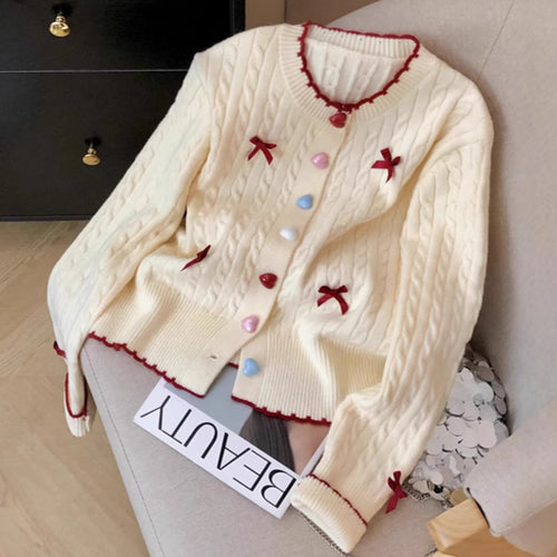 Knitted jacket for women with a playful cable pattern and colorful button details Lune London