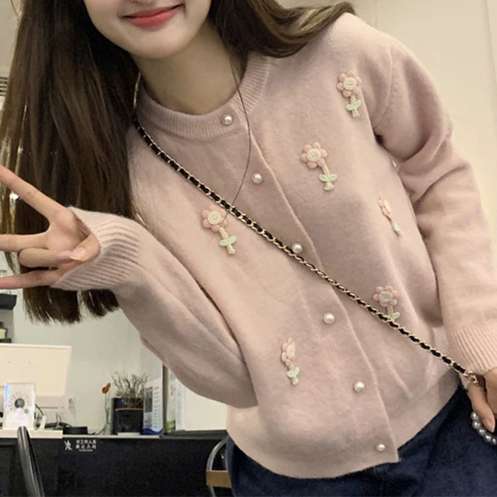 Knit jacket for women with elaborate floral appliqués and elegant pearl buttons Lune London