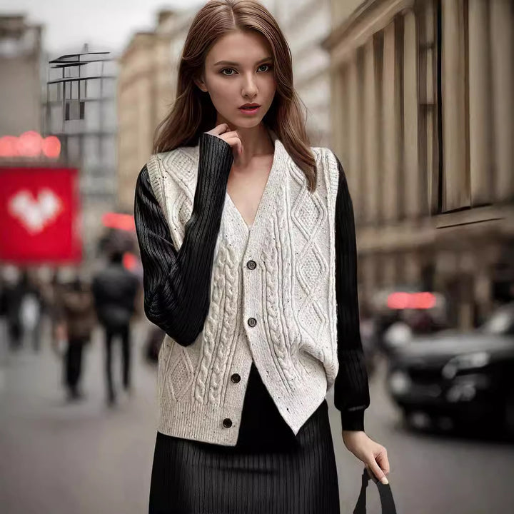 Women's knitted jacket with a modern cable pattern and chic elegant buttons.