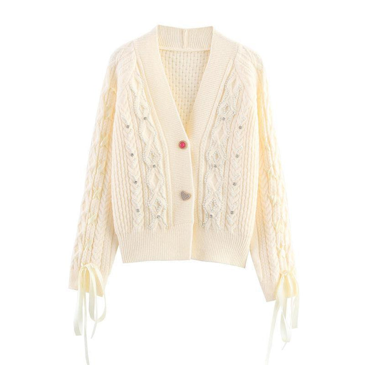 Knitted jacket for women with a detailed textured pattern and elegant ruffle details Lune London