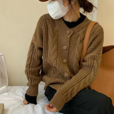 Women's chunky knit sweater with button placket and elegant cable pattern Lune London
