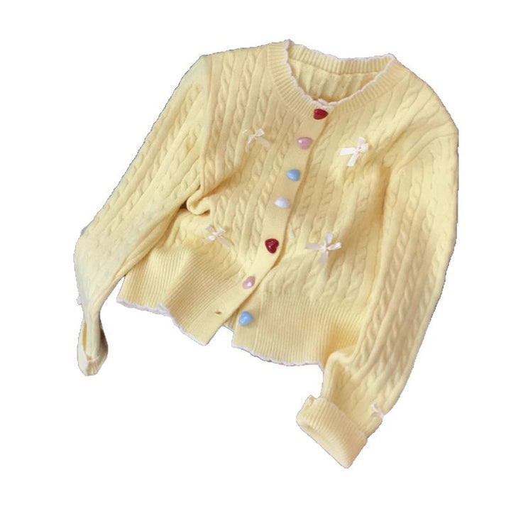 Knitted jacket for women with a playful cable pattern and colorful button details Lune London