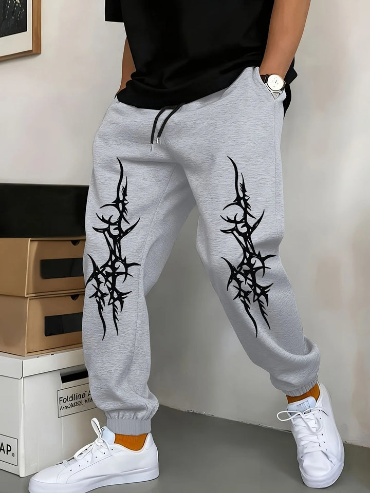 Men's Relaxed Fit Jogging Pants with Eye-Catching Graphic Design Chic & Stil