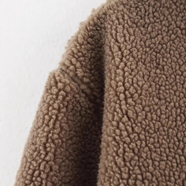Ladies comfortable teddy jacket with practical pockets and button closure Lune London
