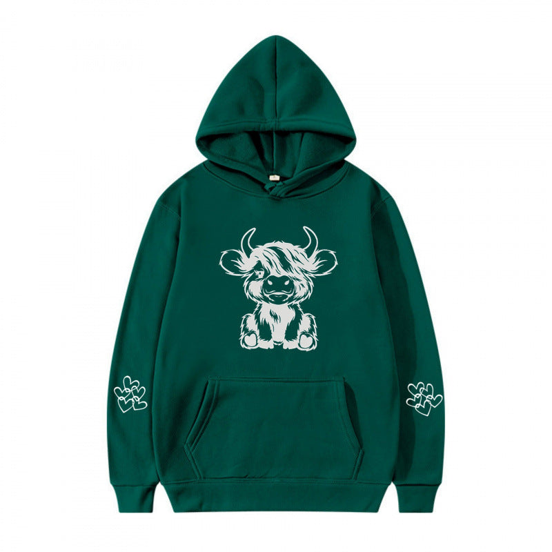 Women's hooded sweatshirt with charming cow motif and practical kangaroo pockets Lune London
