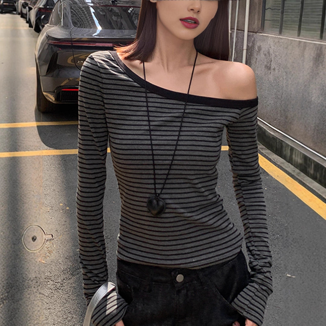 Women's asymmetrical long sleeve shirt with stylish stripes Chic & Stil