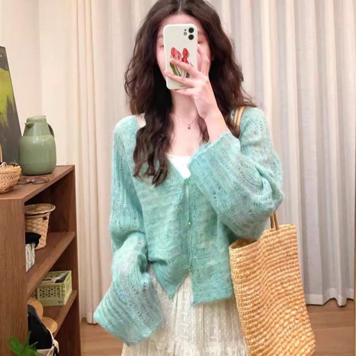 Lightweight knit cardigan for women with a fine openwork knit structure and a loose fit Lune London