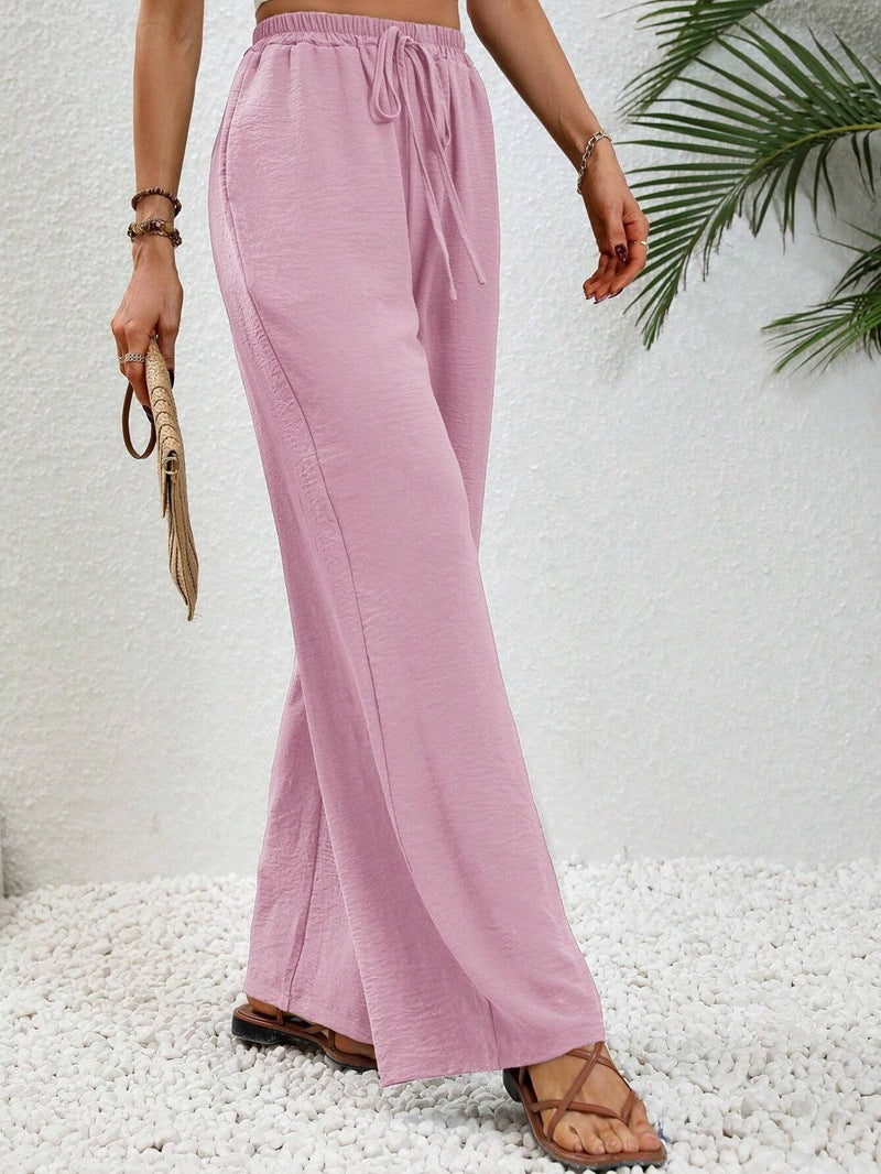 Pantalons larges d'été pour femmes avec taille élastique et poches latérales pratiques Chic & Stil