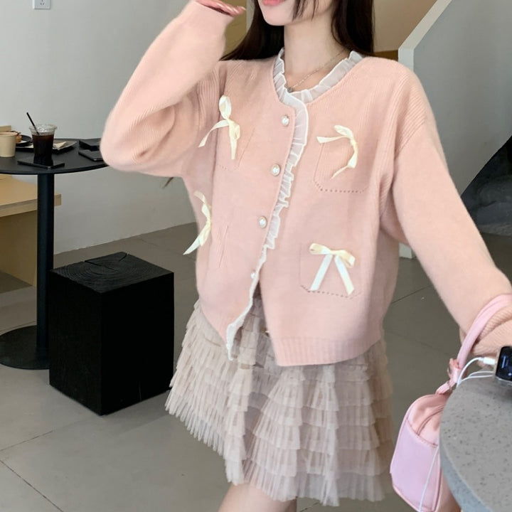 Knitted ladies' jacket with playful knots and pearl buttons Lune London