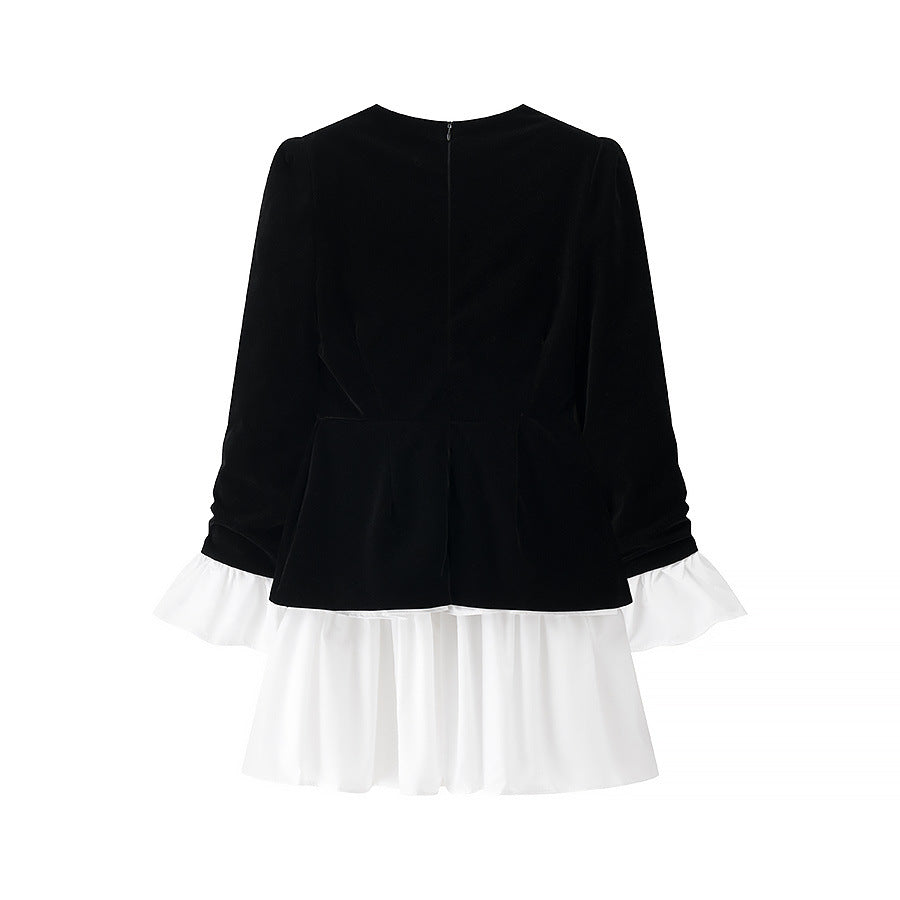 Party dress for ladies with an elegant design in black and white and a ruffle finish Lune London