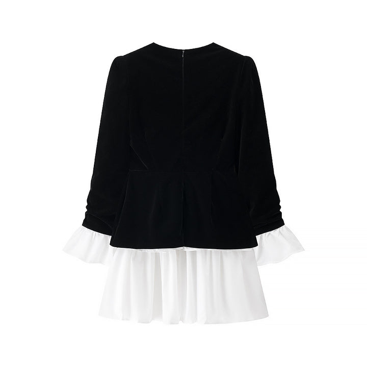 Party dress for ladies with an elegant design in black and white and a ruffle finish Lune London