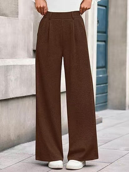 Loose fabric trousers for women with high waist and practical pockets. Chic and style