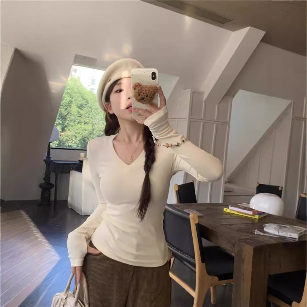 Women's long-sleeve shirt with V-neck and elegant rib structures Chic & Stil